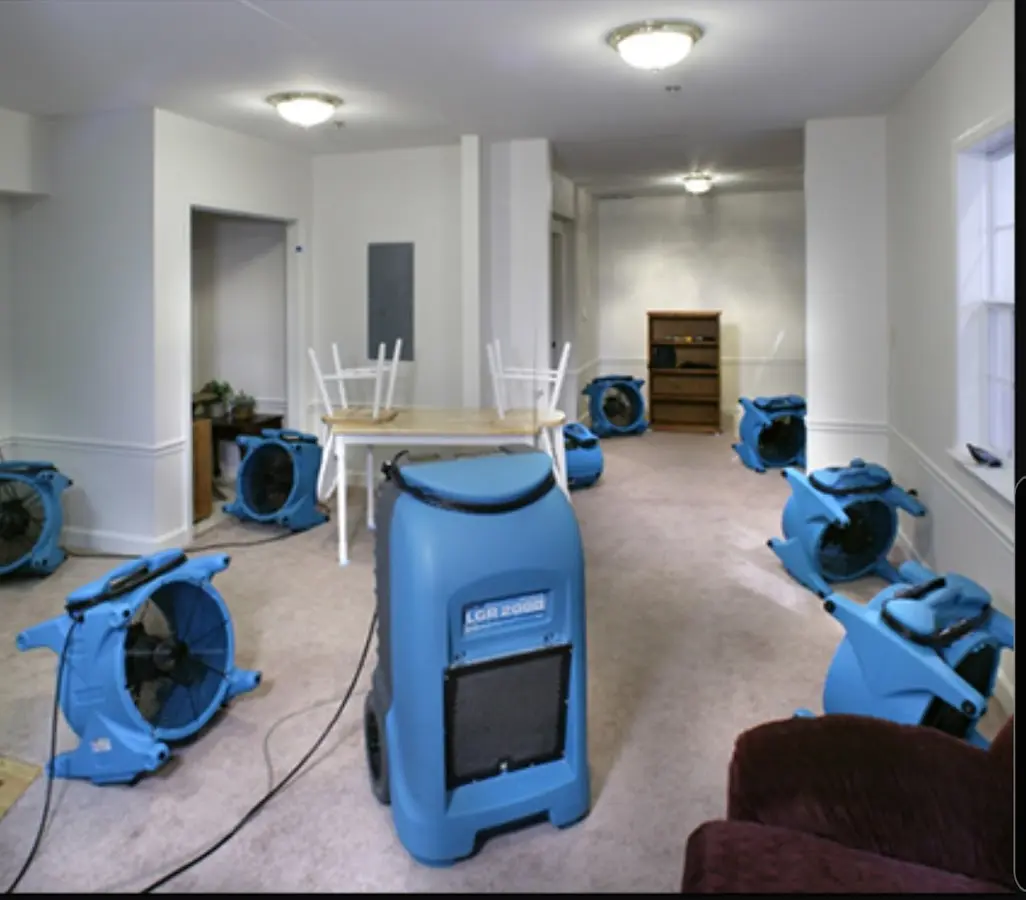 Air movers and dehumidifier setup for Water Damage Restoration in Rigby
